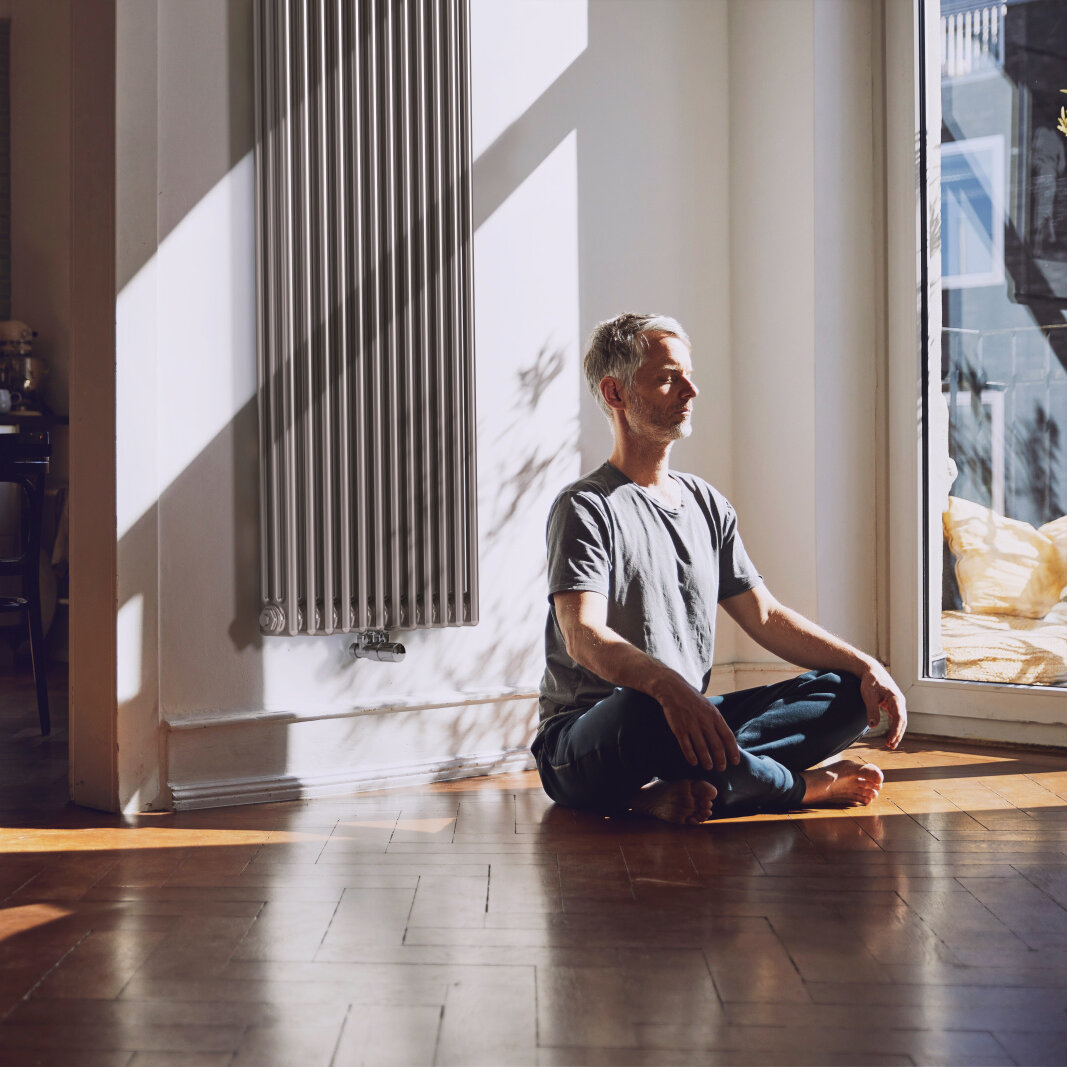 Zehnder_RAD_Charleston-HY_Yoga man meditates, old building flat, relaxed, charleston